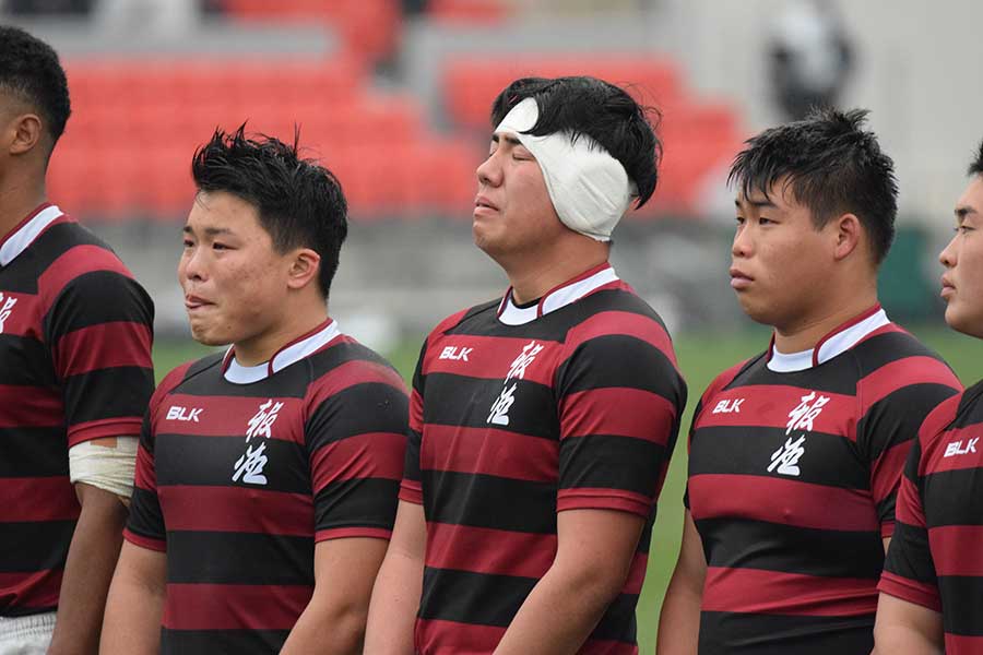 松村さんが撮影した、試合に敗れて涙をこらえる報徳学園の選手たち